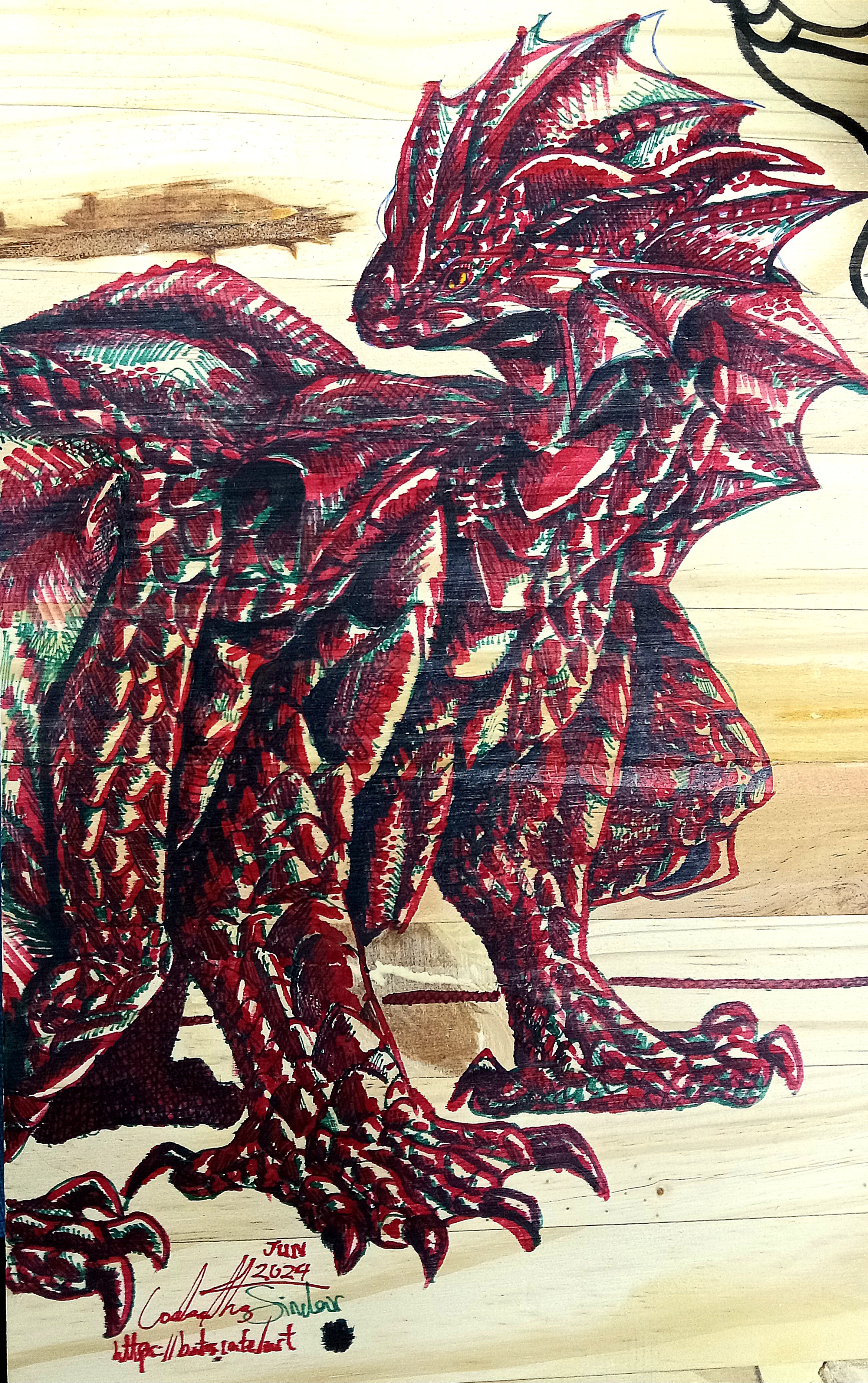 A portrait of a dragon on some wood. Made with red and green markers